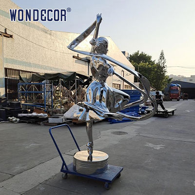 Large stainless steel character shaped outdoor sculpture in the park